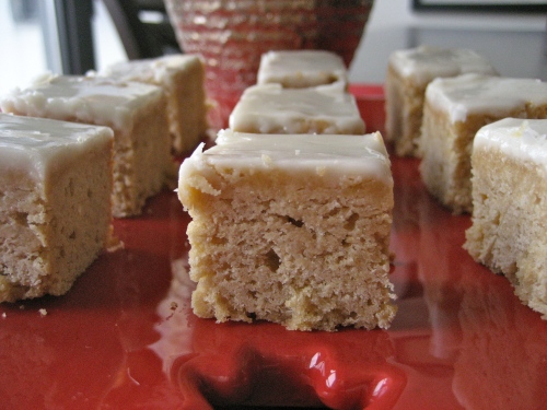 Close up view of nine maple squares on a red Christmas plate